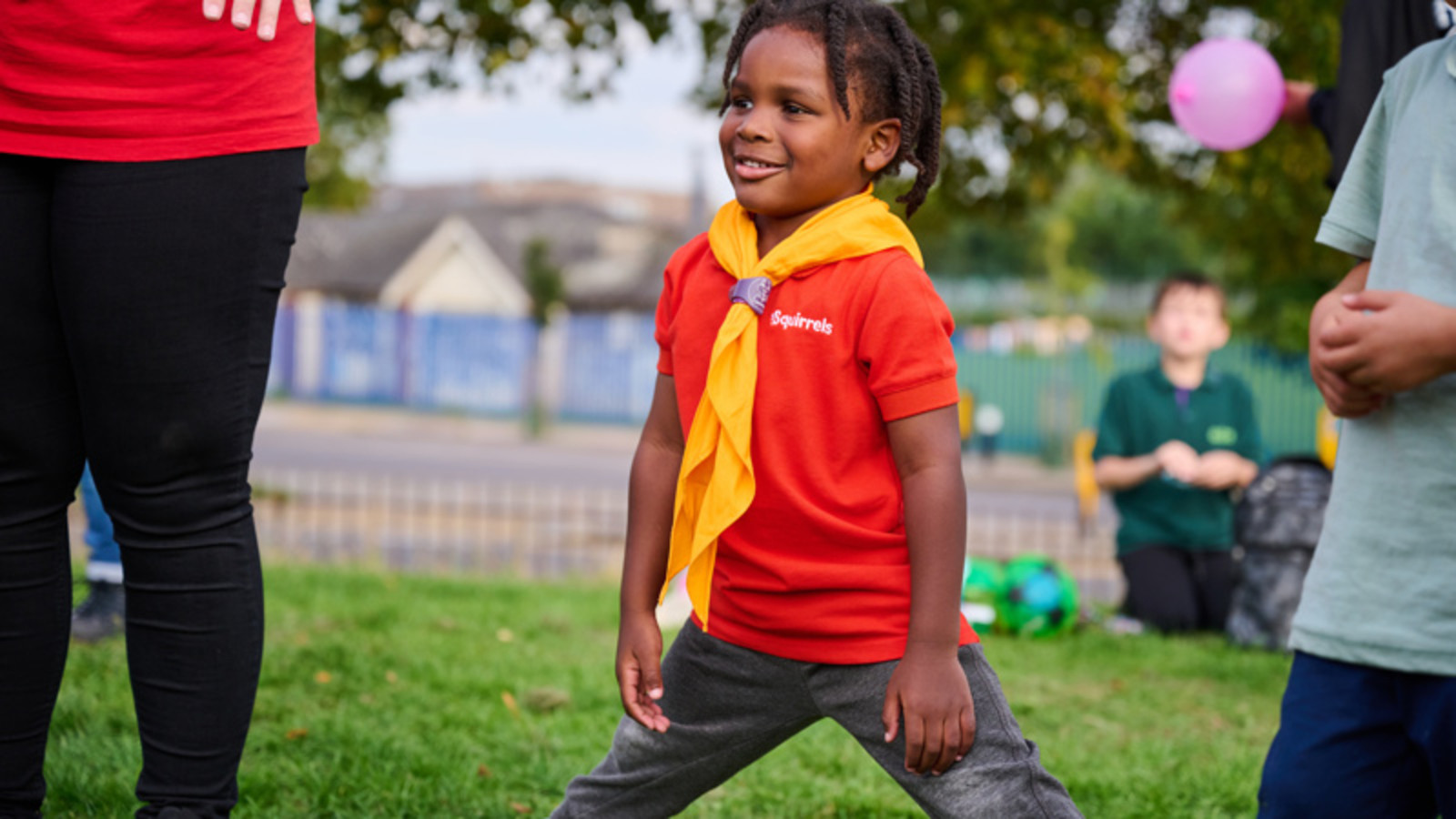 Young scout playing of field