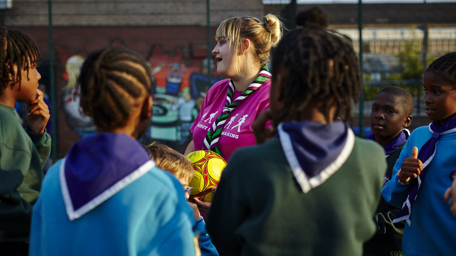 Female leader encouraging beavers and cubs 2 jpg